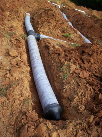 installation of large diameter pipe, in shallow trench Northeast Georgia based GSI offers septic system installation, maintanance and repair